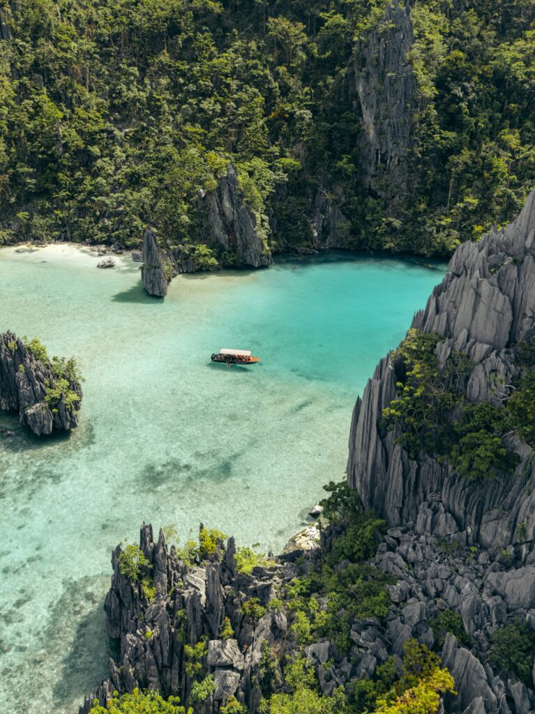 Yohak's private speedboat anchored in small lagoon in El Nido, Palawan.
