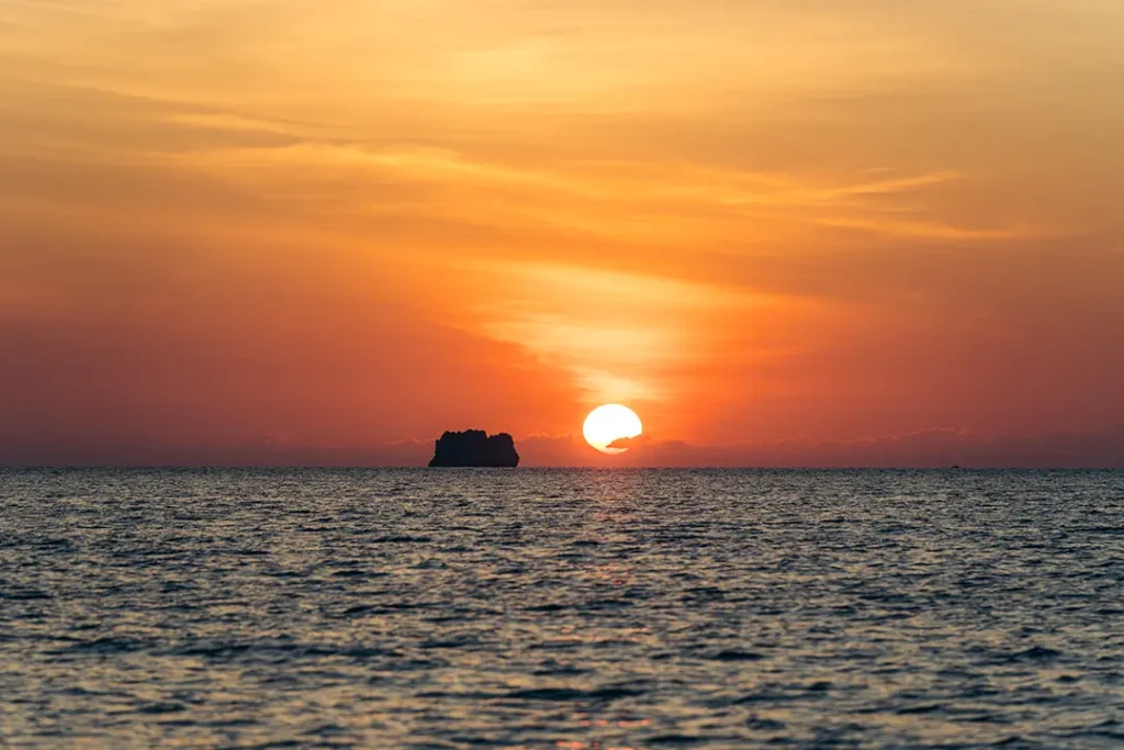 Orange sunset over the sea during a Yohak Palawan expedition