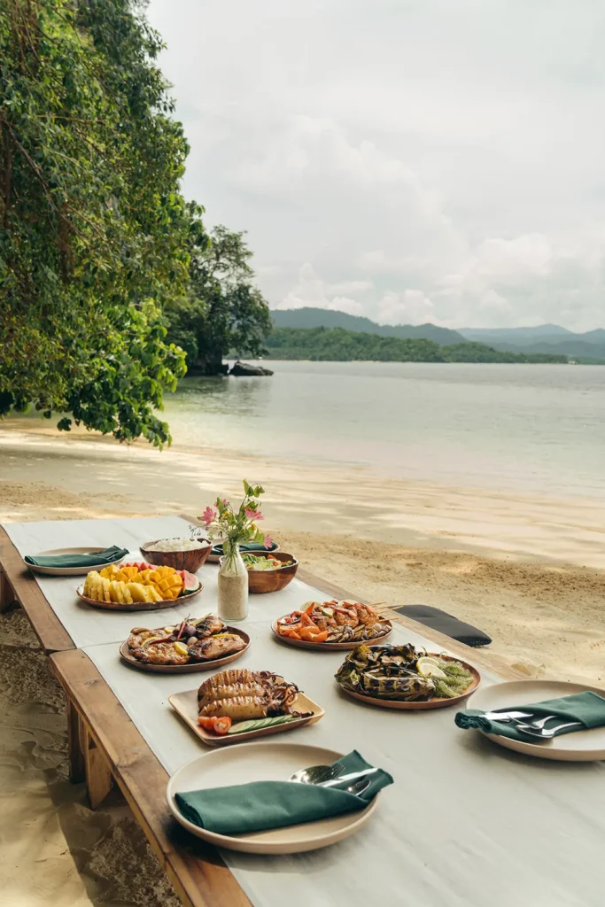 Beachside lunch prepared during a Yohak island expedition in Palawan